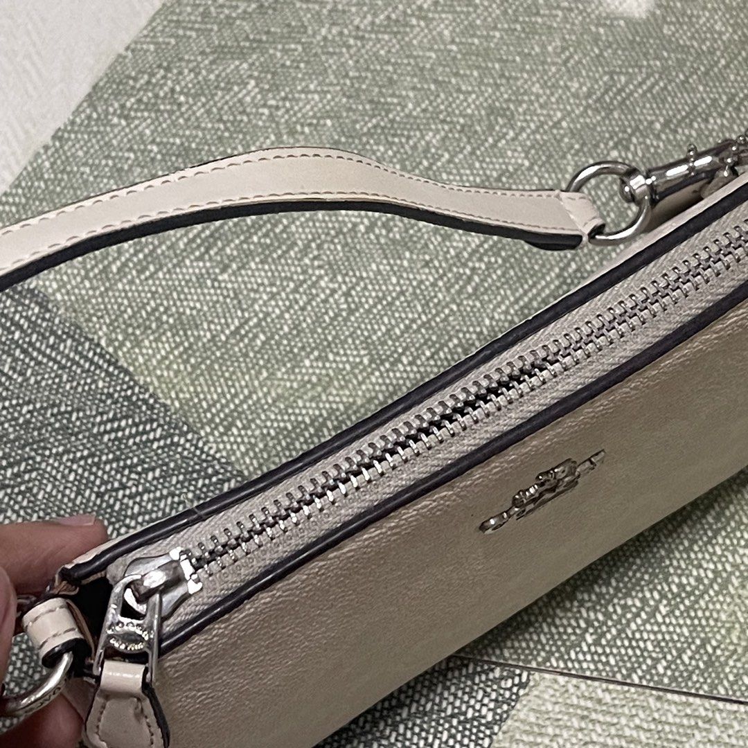 Coach Nolita 19 (Category: Shoulder Bags) located in Pasig City. Submitted by sirendiva_ (Listing ID 1463325497, Image 2). Description: - yellowed bag - zippers need adjustment to zipped fully - black ink marks inside the bag.