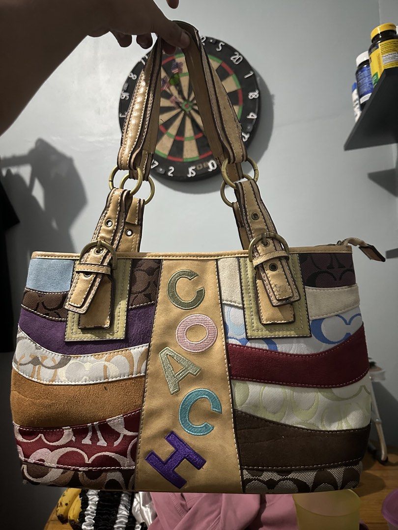 Coach Patchwork Multicolor Leather Shoulder Bag (Category: Luxury Bags & Wallets) located in Villasis. Submitted by justinramosonfb (Listing ID 1463270894, Image 1). Description: - Stylish patchwork design - Embroidered Coach logo - Genuine leather straps and trim - Interior zip pocket - Lined with Coach-branded fabric - Ideal for everyday wear.