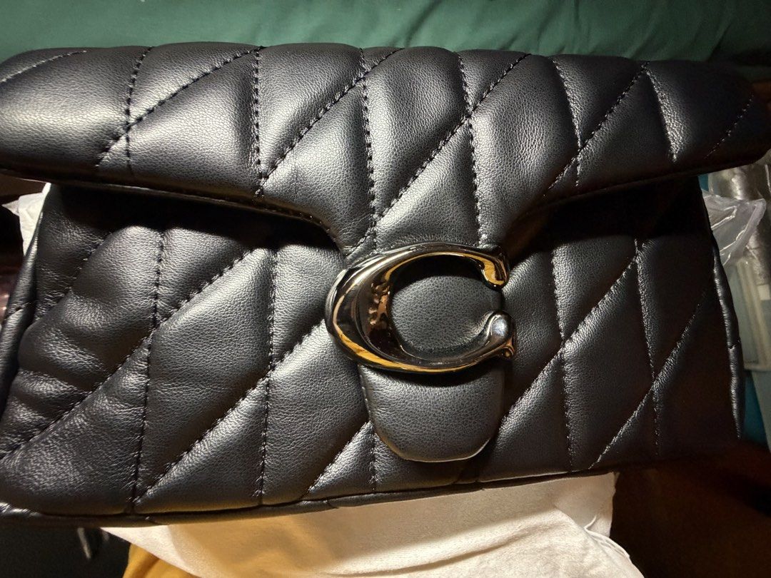 Coach Pillow Tabby Shoulder Bag 18 Black (Category: Luxury Bags & Wallets) located in Quezon City. Submitted by jhosa888 (Listing ID 1463207591, Image 1). Description: - Authentic Coach black quilted leather shoulder bag - Features iconic Coach C hardware - Comes with original dust bag and box - Interior zippered pocket - Ideal for everyday or special occasions.