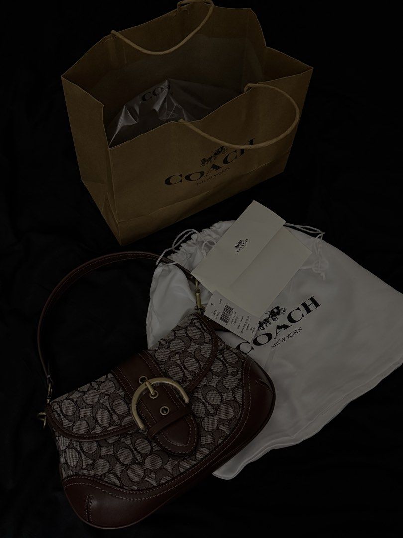 Coach Soho Vintage Bag (Category: Shoulder Bags) located in Quezon City. Submitted by unforgettwble. (Listing ID 1463300885, Image 1). Description: - Classic Coach shoulder bag - Signature C monogram canvas - Dark brown leather trim and buckle detail - Comes with dust bag and original shopping bag - Ideal for everyday use.