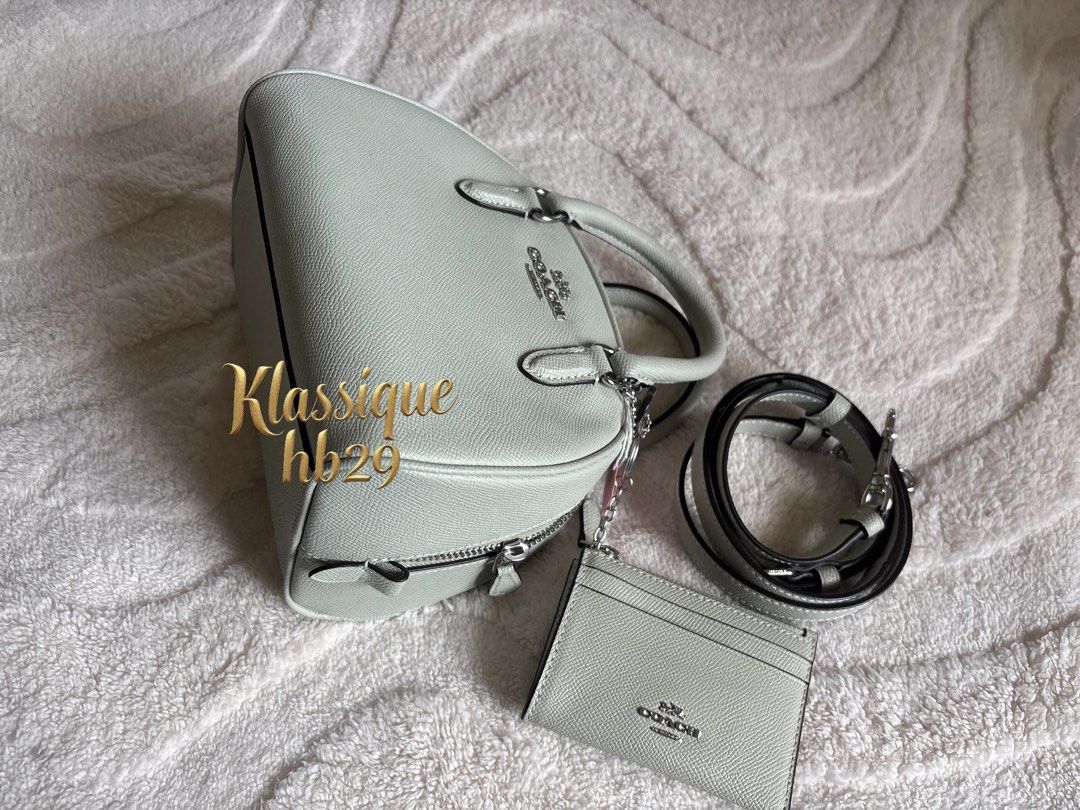 Coach Sydney (Category: Cross-body Bags) located in Lipa City. Submitted by klassique_handbags (Listing ID 1463204489, Image 2). Description: ✅Available✅ ❤️Coach Sydney❤️ Preowned but not used With card case na Fabric type Crossgrain Leather Closure type Zipper Lining Fabric About this item 8’’ (L) x 6’’ (H) x 5’’ (W) Outer Material: Leather Inner Material: Fabric No dust bag included (6,000)php No Lp na po🙏 Murayta na Super mahal ng coach po ng