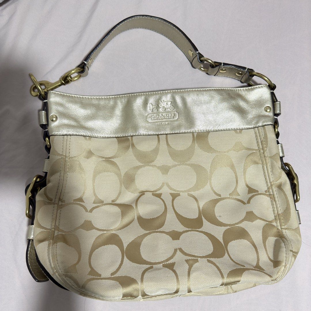 Coach Zoe Monogram Shoulder Bag (Category: Luxury Bags & Wallets) located in San Pedro. Submitted by _alvsd (Listing ID 1463208749, Image 1). Description: - Classic Coach monogram shoulder bag - Elegant beige and gold colorway - Genuine leather trim and strap - Stylish gold hardware details - Ample interior space for essentials - Ideal for everyday use - Pm for details.