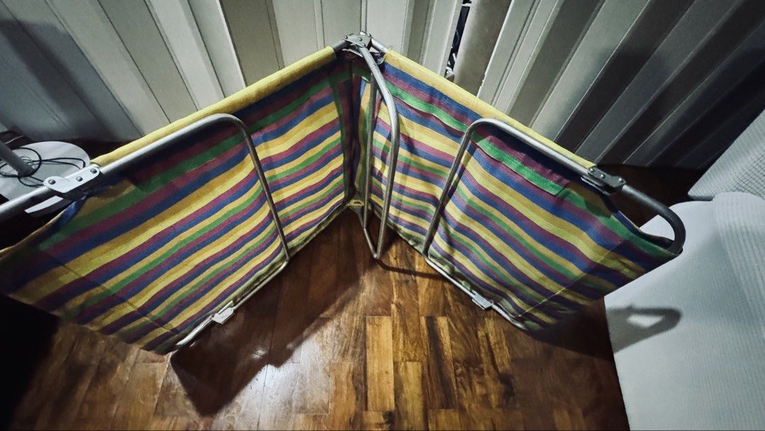 Colorful Striped Folding bed (Category: Bed Frames & Mattresses) located in Quezon City. Submitted by gcc216 (Listing ID 1463243159, Image 2). Description: - Portable and foldable design for easy storage and transport. - Sturdy metal frame ensures durability and stability. - Vibrant striped fabric adds a pop of color. - Quick and easy setup and takedown. - Ideal for camping, picnics, outdoor events, or extra home seating. - Lightweight for effort