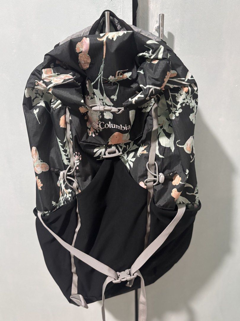 Columbia Floral Hiking Backpack (Category: Backpacks) located in La Trinidad. Submitted by caicai1926 (Listing ID 1463234959, Image 2). Description: - Cute Columbia backpack with black base and floral print. - Features adjustable straps for a comfortable fit. - Multiple pockets for organized storage. - Lightweight and durable material, ideal for travel. - Perfect for day trips, hiking, or everyday adventures..