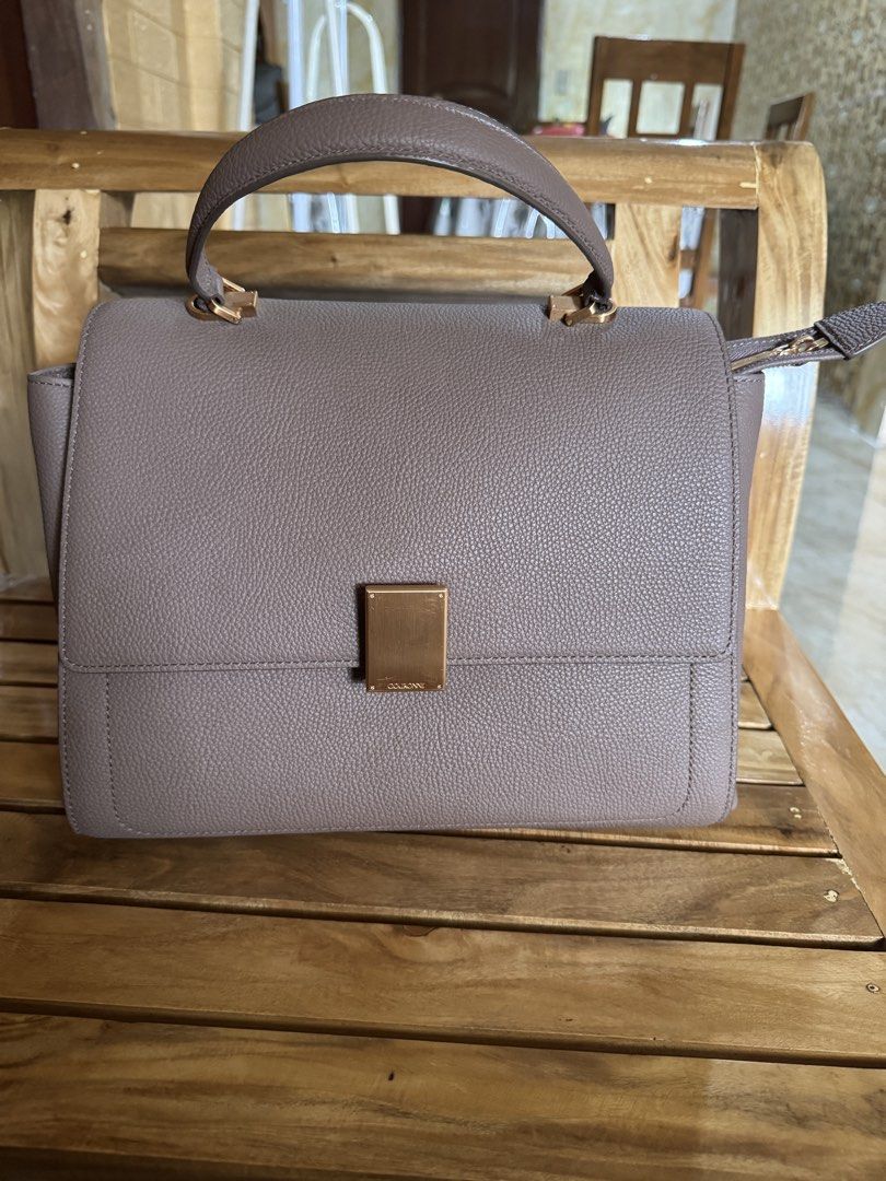 Courone Taupe Top Handle Bag with Strap (Category: Shoulder Bags) located in Sagbayan (Borja). Submitted by judesajong05326 (Listing ID 1463176667, Image 1). Description: - Elegant taupe top handle bag - Features gold hardware details - Comes with an adjustable shoulder strap for versatile carrying - Large size.