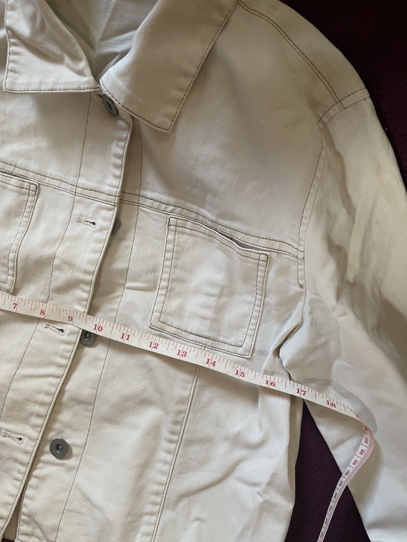 Cream Denim Jacket (Category: Coats, Jackets and Outerwear) located in Tanza. Submitted by pattycakex (Listing ID 1463316217, Image 3). Description: - Classic cream denim jacket - Button-up front - Two chest pockets - Estimated size: Medium - Ideal for layering - Versatile and easy to style.