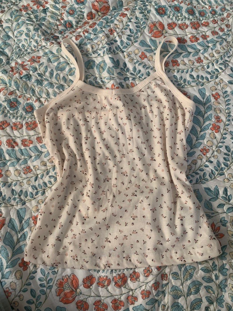 Cream Floral Ribbed Tank Top (Category: Sleeveless) located in Manila. Submitted by curatedclassics (Listing ID 1463206600, Image 1). Description: never used fits small, hugs waist area.