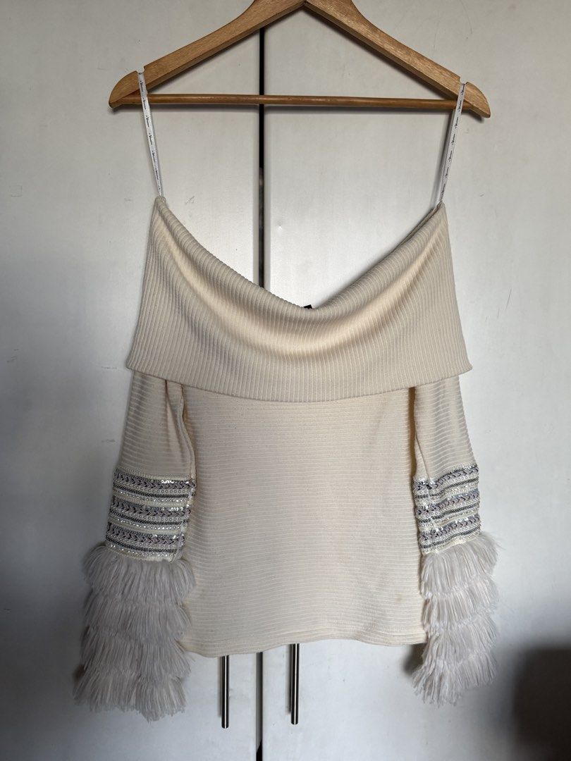 Cream Off Shoulder Knit Top (Category: Longsleeves) located in Quezon City. Submitted by itsbiancag (Listing ID 1463315800, Image 1). Description: - Off-the-shoulder cream rib-knit top - Sparkling sequin bands and fluffy faux-fur cuffs - Super pretty in person! - Nice thick and soft fabric - Fits XS-S.