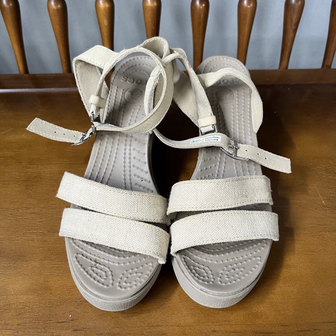 Crocs Beige Canvas Wedge Sandals (Category: Sandals) located in Calamba. Submitted by jupreloved_ (Listing ID 1463145612, Image 1). Description: Comfy beige Crocs wedge sandals with canvas straps and adjustable buckle. Perfect for summer. Brand: Crocs Size: 37 Women Shipping through J&T. Payment are strictly through GCASH only, no COD. Exact size and color may be different from the picture. This is a preloved item, please manage your expectations
