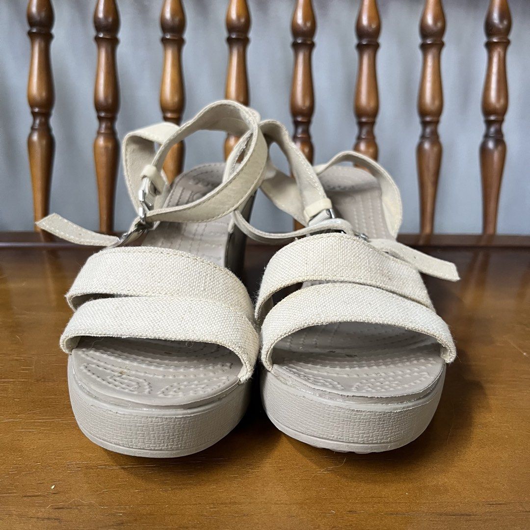 Crocs Beige Canvas Wedge Sandals (Category: Sandals) located in Calamba. Submitted by jupreloved_ (Listing ID 1463145612, Image 2). Description: Comfy beige Crocs wedge sandals with canvas straps and adjustable buckle. Perfect for summer. Brand: Crocs Size: 37 Women Shipping through J&T. Payment are strictly through GCASH only, no COD. Exact size and color may be different from the picture. This is a preloved item, please manage your expectations