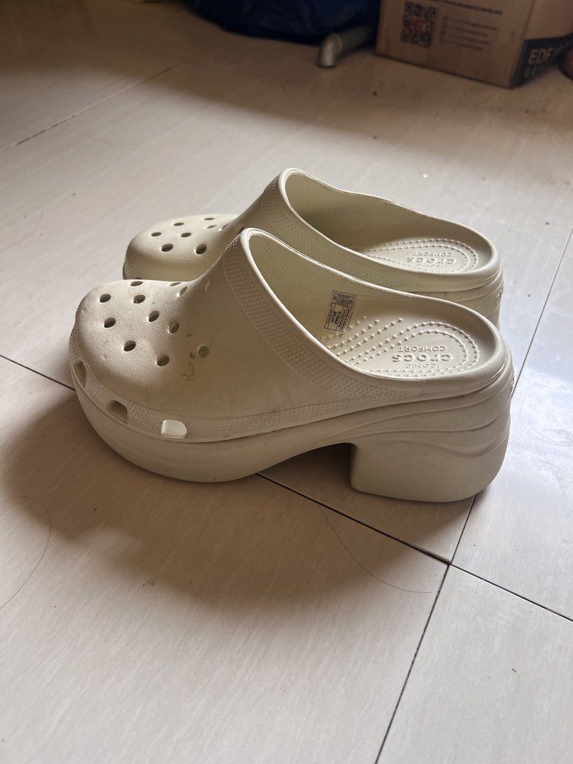 Crocs Platform Clogs Beige Size 7/9 (Category: Slippers and slides) located in Zamboanga. Submitted by safe.haimer (Listing ID 1463229239, Image 2). Description: - Beige Crocs platform clogs - Size: M7/W9 (250/25) - Made in Vietnam - Platform style for added height - Easy slip-on design - Ideal for casual wear.
