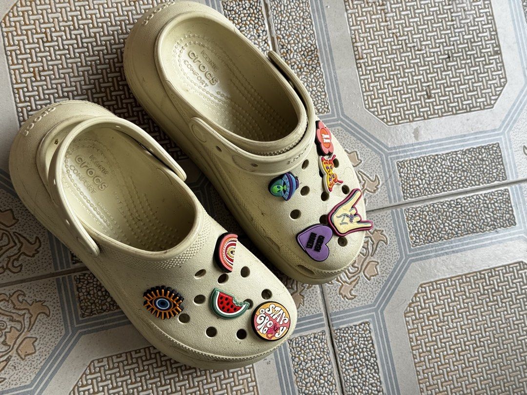 Crocs platform with Assorted Jibbitz Charms - Black & Cream (Category: Slippers and slides) located in Marikina City. Submitted by daintyaesthetics (Listing ID 1463138525, Image 2). Description: 1,800 EACH or 3k for both - Bundle Deal: Get both black and cream Crocs! - Size: M4/W6 for both pairs - Black Crocs with fun Jibbitz (eyes, sun, butterflies, etc.) - Cream Crocs with fun Jibbitz (eyes, sun, butterflies, etc.) - Perfect for casual wear and