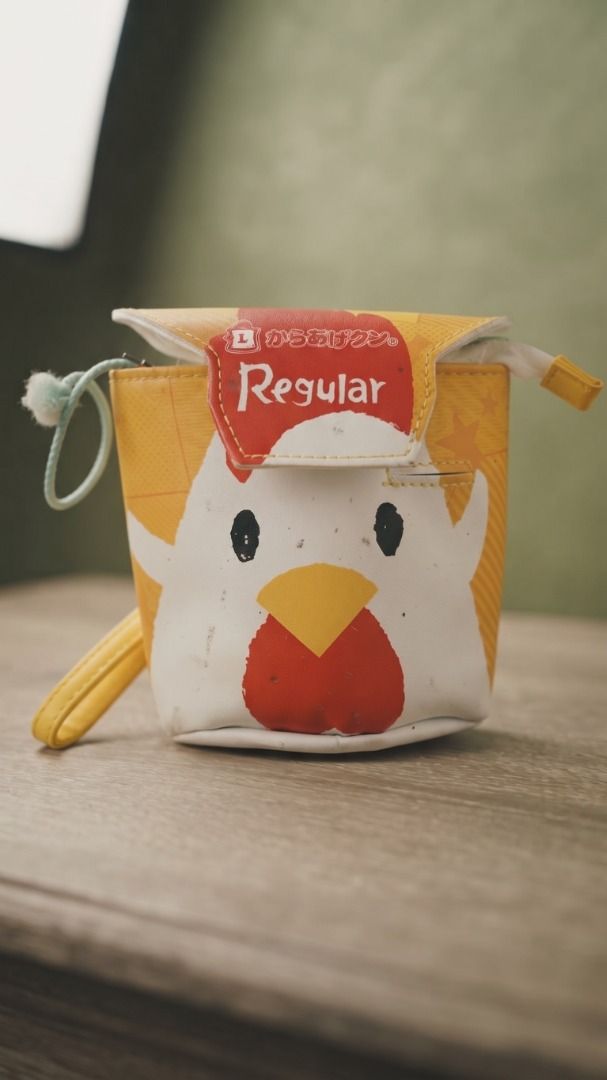 Cute Chicken Design Pouch with Wrist Strap (Category: Purses & Pouches) located in Quezon City. Submitted by eilgaraje (Listing ID 1463184915, Image 1). Description: - Adorable yellow coin pouch featuring a cute chicken design. - Red and white top flap with 'Regular' text. - Includes a convenient yellow wrist strap. - A fun and quirky accessory to add to your collection. japan surplus as posted used.
