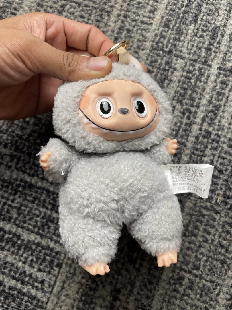 Cute Fluffy Grey Monster Plush Keychain Toy (Category: Plushies & Soft Toys) located in Manila. Submitted by rdtp2 (Listing ID 1463135647, Image 2). Description: - Adorable fluffy grey monster plush keychain. - Features a loop and ring for easy attachment to bags or keys. - Detailed face with big eyes and a wide smile. - Adds a fun touch to your accessories. - Makes a great gift idea!.