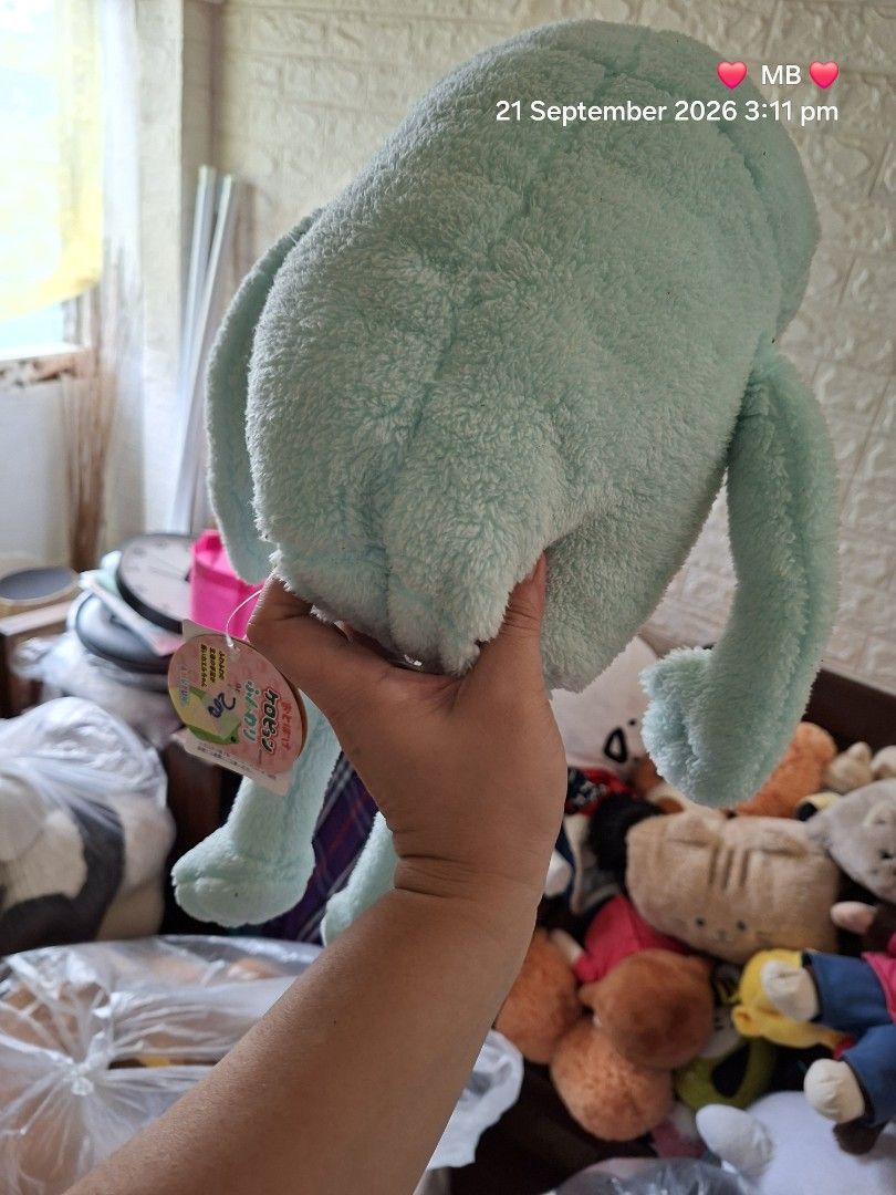 Cute Frog Plush Toy (Category: Plushies & Soft Toys) located in Lucena. Submitted by dai_suki (Listing ID 1463321615, Image 2). Description: - Super soft and squishy frog plushie - Adorable light blue and cream colors - Approximately 1.5 feet long - Perfect for cuddling or as a cute room decoration - Ideal gift for kids or any frog enthusiast - Clean and ready for its new home.