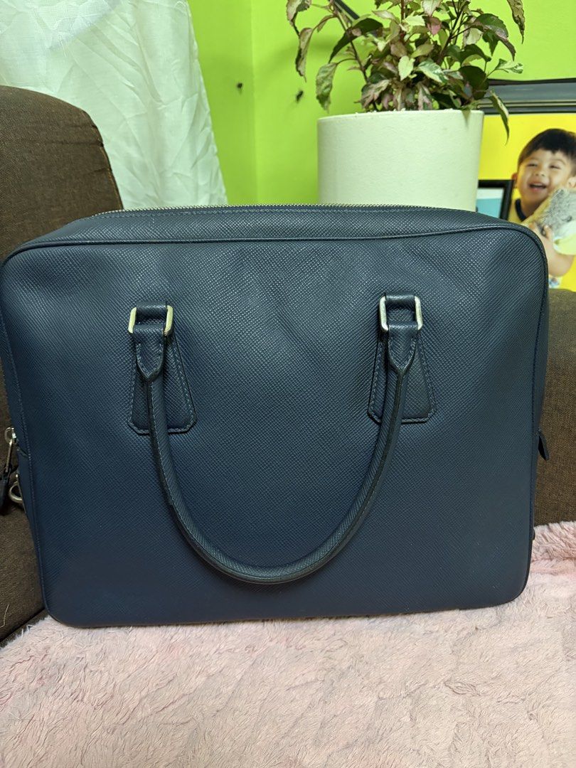 Dark Blue Leather Briefcase (Category: Briefcases) located in Saravia. Submitted by clynlyn (Listing ID 1463179988, Image 1). Description: - Dark blue textured leather briefcase - Secure zip closure - Two comfortable top handles - Multiple interior compartments for organization - Interior zip pockets for valuables - Ample space, perfect for work or travel.