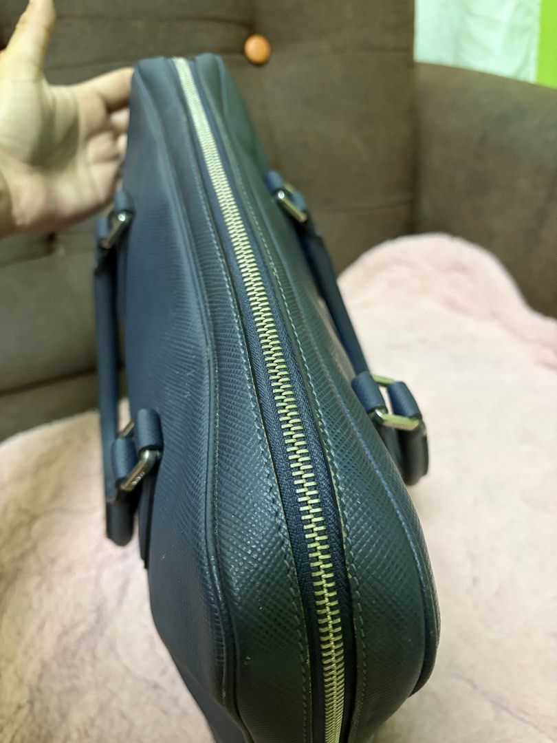 Dark Blue Leather Briefcase (Category: Briefcases) located in Saravia. Submitted by clynlyn (Listing ID 1463179988, Image 2). Description: - Dark blue textured leather briefcase - Secure zip closure - Two comfortable top handles - Multiple interior compartments for organization - Interior zip pockets for valuables - Ample space, perfect for work or travel.