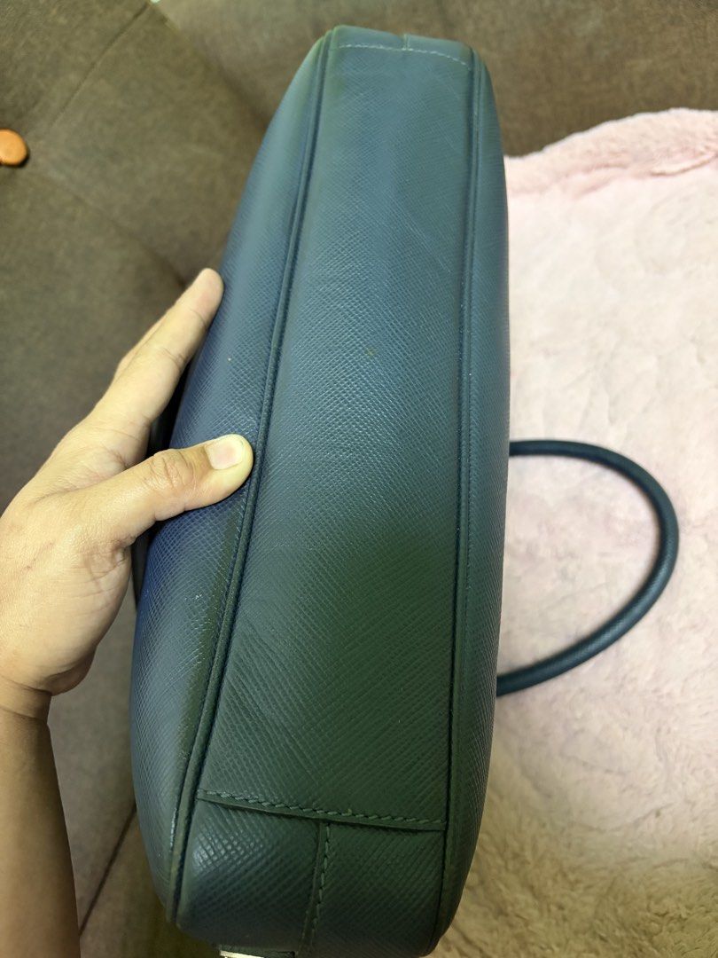 Dark Blue Leather Briefcase (Category: Briefcases) located in Saravia. Submitted by clynlyn (Listing ID 1463179988, Image 3). Description: - Dark blue textured leather briefcase - Secure zip closure - Two comfortable top handles - Multiple interior compartments for organization - Interior zip pockets for valuables - Ample space, perfect for work or travel.