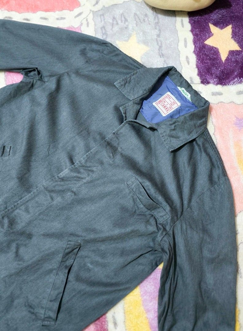 Dark Grey Workwear Jacket [PRELOVED] (Category: Coats, Jackets and Outerwear) located in Paranaque City. Submitted by vanchris84 (Listing ID 1463268547, Image 3). Description: - Classic dark grey workwear jacket - Button-up front - Two chest pockets - Two hip pockets - Long sleeves with button cuffs - Simple collar - Great for layering or standalone wear - Versatile style.