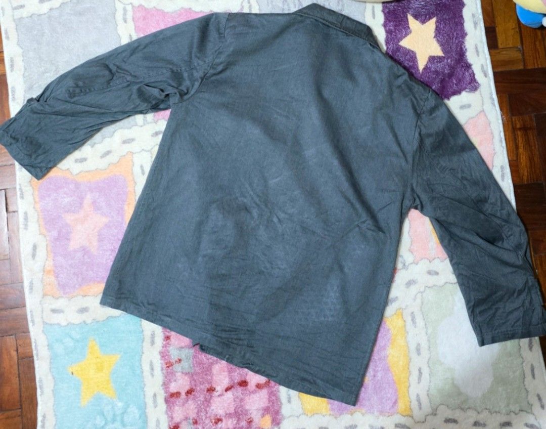 Dark Grey Workwear Jacket [PRELOVED] (Category: Coats, Jackets and Outerwear) located in Paranaque City. Submitted by vanchris84 (Listing ID 1463268547, Image 2). Description: - Classic dark grey workwear jacket - Button-up front - Two chest pockets - Two hip pockets - Long sleeves with button cuffs - Simple collar - Great for layering or standalone wear - Versatile style.