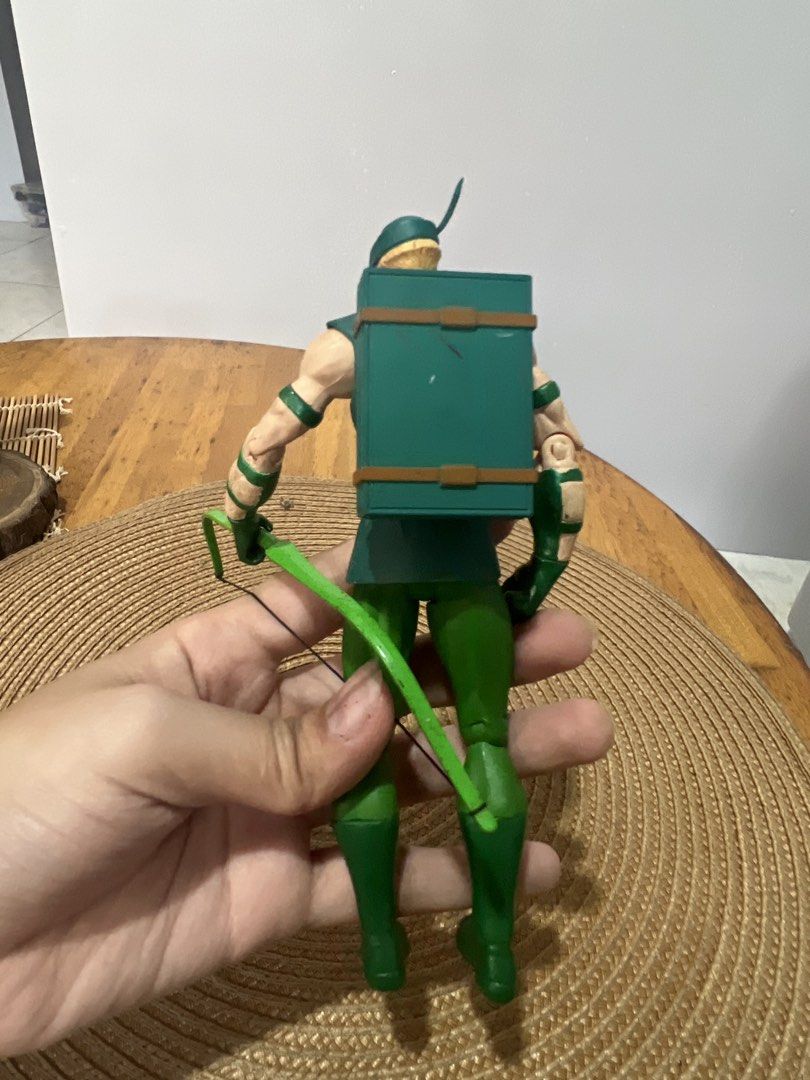 DC Comics Green Arrow Action Figure with Bow (Category: Figurines & Statues) located in Bocaue. Submitted by kwon_017 (Listing ID 1463122693, Image 2). Description: - good condition, needs cleaning sa bandang lalagyan ng arrows - missing arrows and stand - Green Arrow action figure - Includes signature bow and quiver - Poseable limbs for dynamic display - Ideal for DC Comics fans and collectors - Classic representation of the Emerald Archer.