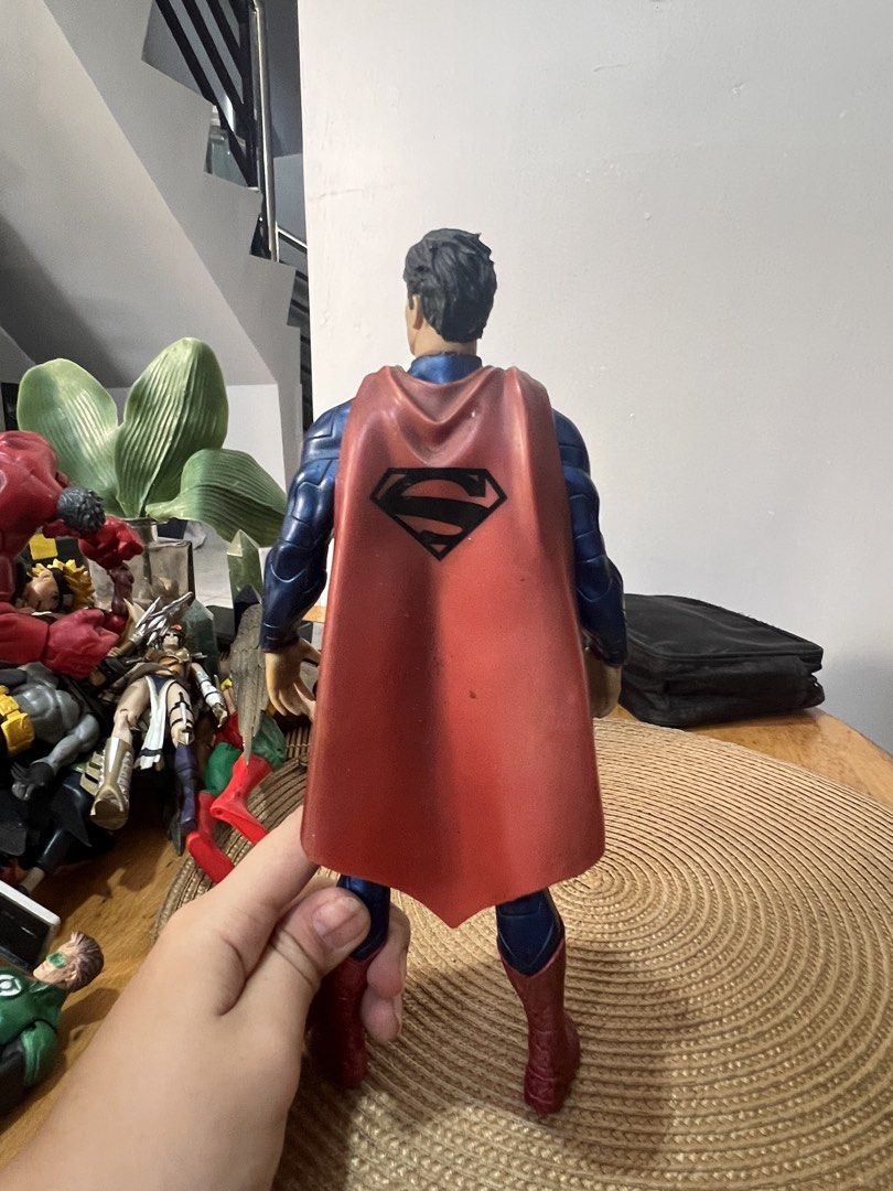 DC Comics Superman Action Figure - Crazy Toys (Category: Figurines & Statues) located in Bocaue. Submitted by kwon_017 (Listing ID 1463127777, Image 2). Description: - very good condition - needs light cleaning! - Superman action figure by Crazy Toys - Approximately 12 inches tall - Classic blue suit with red cape and boots - Iconic 'S' shield on chest and back - Minor dust and scuffs present on figure and base - Perfect for collectors.
