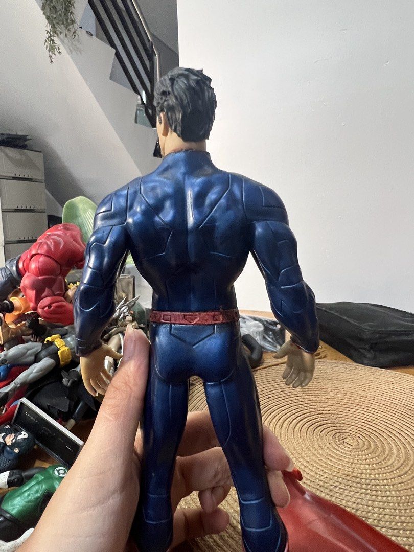 DC Comics Superman Action Figure - Crazy Toys (Category: Figurines & Statues) located in Bocaue. Submitted by kwon_017 (Listing ID 1463127777, Image 3). Description: - very good condition - needs light cleaning! - Superman action figure by Crazy Toys - Approximately 12 inches tall - Classic blue suit with red cape and boots - Iconic 'S' shield on chest and back - Minor dust and scuffs present on figure and base - Perfect for collectors.