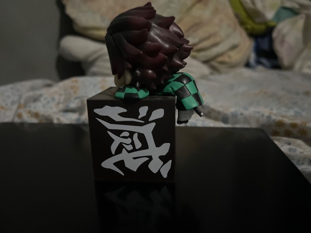 Demon Slayer Tanjiro Chibi Figure (Category: Designer & Blind Box Toys) located in Caloocan City. Submitted by liveearth-e7e5 (Listing ID 1463233405, Image 2). Description: - Cute Tanjiro chibi figure from Demon Slayer - Features Tanjiro peeking over a black block with Japanese characters - Small and collectible size - Ideal for anime fans and collectors - Perfect for displaying on desks or shelves.