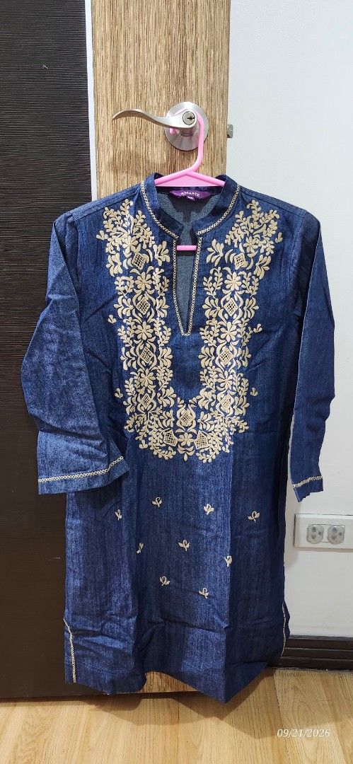 Denim Kurti with Gold Embroidery (Category: Dresses) located in Manila. Submitted by atan2025 (Listing ID 1463227238, Image 1). Description: - Blue denim kurti - Intricate embroidery on neckline and scattered motifs - Long sleeves with embroidered cuffs - Fabric has a slight sheen - Brand: Amarie - Suitable for casual or semi-formal wear.