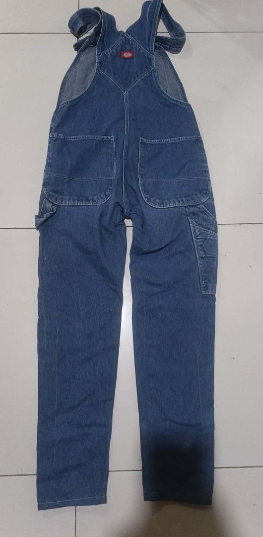 Dickies Denim Overalls Blue (Category: Jumpsuits) located in San Carlos City. Submitted by dhong_abay_thrift (Listing ID 1463204378, Image 1). Description: - Classic blue denim overalls by Dickies - Button fly front - Multiple functional pockets - Adjustable straps for a customized fit - Durable material, perfect for work or casual wear - A timeless wardrobe staple 57 L x 32 waist x 6 hem issue change hem.