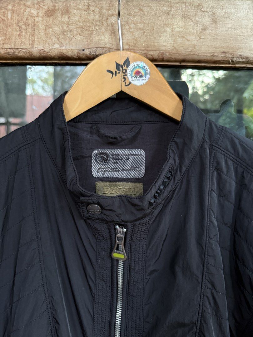 DIESEL x DUCATI nylon jacket (Category: Coats, Jackets and Outerwear) located in Manolo Fortich. Submitted by thriftacktoe34 (Listing ID 1463252811, Image 2). Description: Excellent condition Color rate 9.5/10 Size XL Dimes W23 x L27 Issue: medyo law2 na cuffs tas yung sa back part pero presentable pa suotin FREE shipping fee.