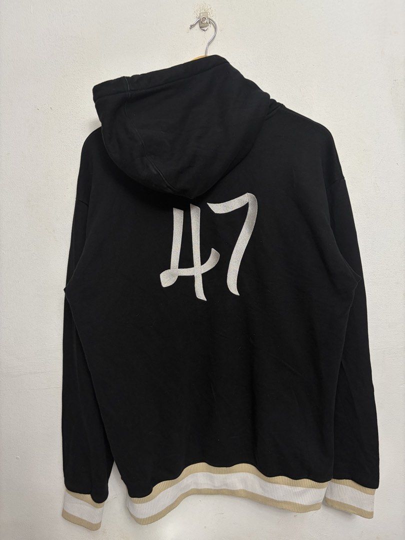 Dior '47' Black Hoodie (Category: Hoodies) located in Bulacan. Submitted by chrlzchrstnfntn33 (Listing ID 1463136093, Image 2). Description: - Authentic Dior hoodie - Size: Medium (M) - Design: 'Dior' logo on front, '47' graphic on back - Details: Ribbed cuffs and hem with beige and white stripes - Origin: Made in Italy.