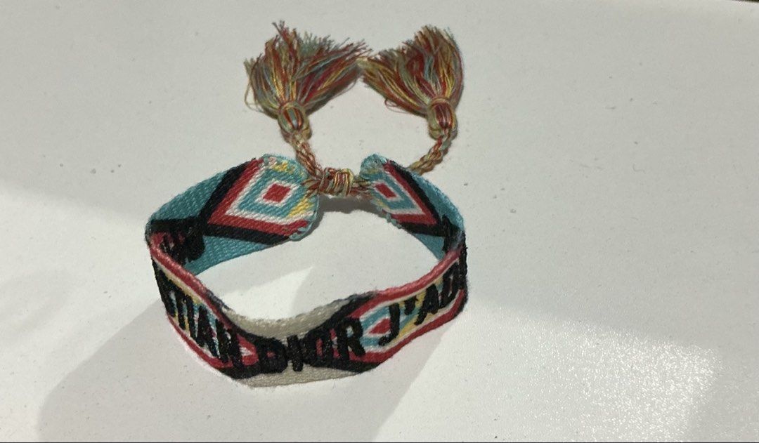 Dior J'Adior Woven Bracelet (Category: Bracelets) located in Bulacan. Submitted by toogoodtobegarbage (Listing ID 1463254526, Image 3). Description: - Woven bracelet - Features colorful geometric patterns - Adorned with tassels - Adjustable tie closure for a perfect fit - Adds flair to any outfit -no flaws.