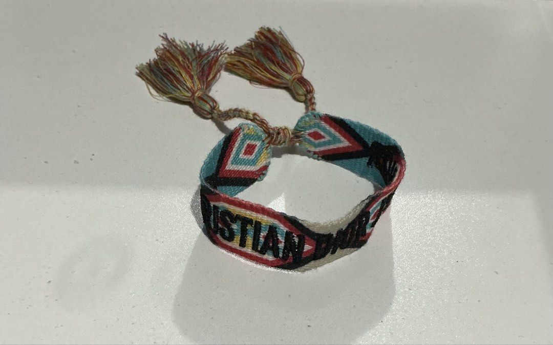 Dior J'Adior Woven Bracelet (Category: Bracelets) located in Bulacan. Submitted by toogoodtobegarbage (Listing ID 1463254526, Image 2). Description: - Woven bracelet - Features colorful geometric patterns - Adorned with tassels - Adjustable tie closure for a perfect fit - Adds flair to any outfit -no flaws.