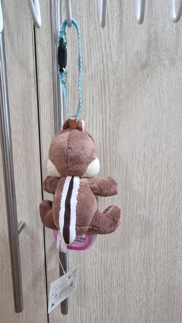 Disney Chip 'n Dale Plush Keychain with Strap (Category: Character Goods) located in Paranaque City. Submitted by olxph_668280920 (Listing ID 1463321724, Image 2). Description: - Adorable Chip 'n Dale plush keychain - Features a brown chipmunk with white stripes - Includes a blue woven strap - Comes with a sturdy black clip - Ideal for decorating bags, backpacks, or as a keychain - A must-have for any Disney enthusiast!.