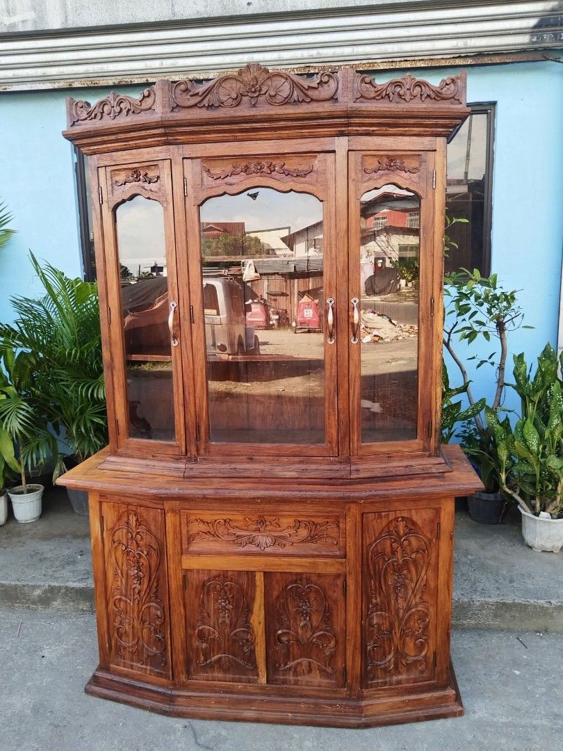 Display Cabinet (Category: Shelves, Cabinets & Racks) located in Meycauayan. Submitted by marygracecasimiro (Listing ID 1463218279, Image 2). Description: China Cabinet or Platera made of solid Narra wood with carvings on both side. Top portion is movable. Restored and revarnished. Ready to use.♥️ Get it for only P23,450. Size H81 x L54 x W20 inches.