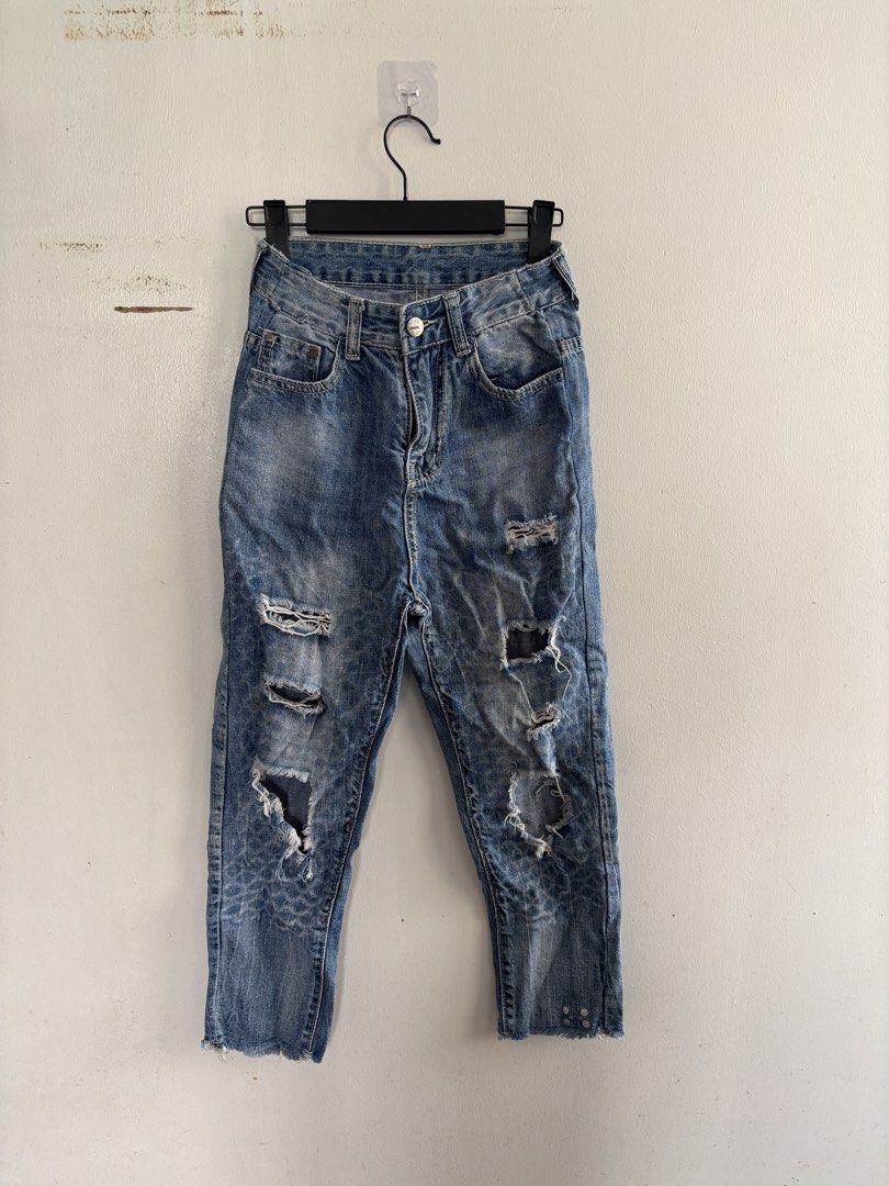 Distressed Blue Denim Jeans (Category: Jeans) located in Muntinlupa City. Submitted by jc444_ (Listing ID 1463306335, Image 1). Description: - Cool distressed blue denim jeans - Cropped length with frayed hem - Edgy look with rips and tears - Light wash with subtle pattern details on lower legs - Great for casual wear.