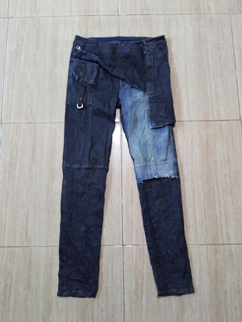 Distressed Patchwork Denim Jeans with Wrap Detail (Category: Activewear) located in Glan. Submitted by cpaharodde48008 (Listing ID 1463214547, Image 1). Description: - Unique denim jeans with a stylish patchwork design. - Features a distinctive wrap-around detail on the front. - Multiple functional pockets on both the front and back. - Distressed elements for a cool, edgy aesthetic. - Ideal for creating a standout outfit..