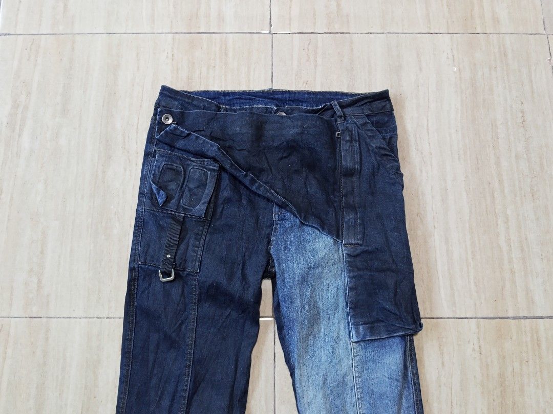 Distressed Patchwork Denim Jeans with Wrap Detail (Category: Activewear) located in Glan. Submitted by cpaharodde48008 (Listing ID 1463214547, Image 3). Description: - Unique denim jeans with a stylish patchwork design. - Features a distinctive wrap-around detail on the front. - Multiple functional pockets on both the front and back. - Distressed elements for a cool, edgy aesthetic. - Ideal for creating a standout outfit..