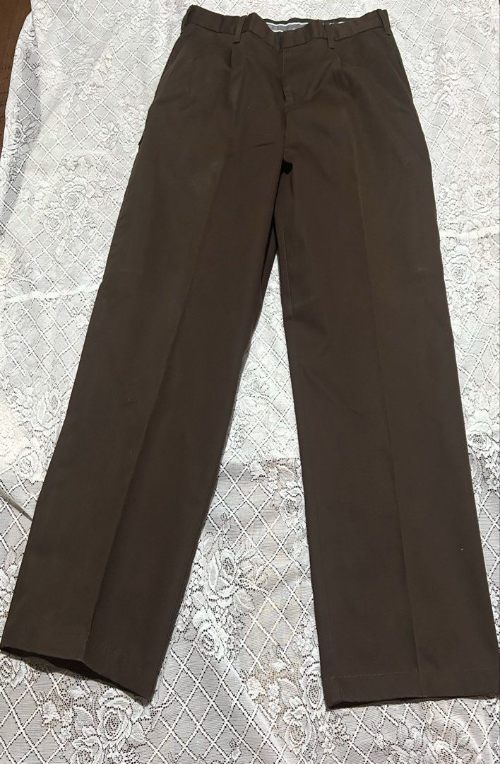 Dockers Khakis Brown Pleated Pants (Category: Trousers) located in Plaridel. Submitted by ilovebubu28 (Listing ID 1463207545, Image 3). Description: - Brown Dockers khakis - Classic fit, suitable for everyday wear - Pleated design - Button and zip closure - Features an inner mini pocket - Please check photos for detailed condition Color rate 10/10 at once lang naused . Bought mismo sa Dockers store Dimensions: Length : 39.5” Width 33-34”.