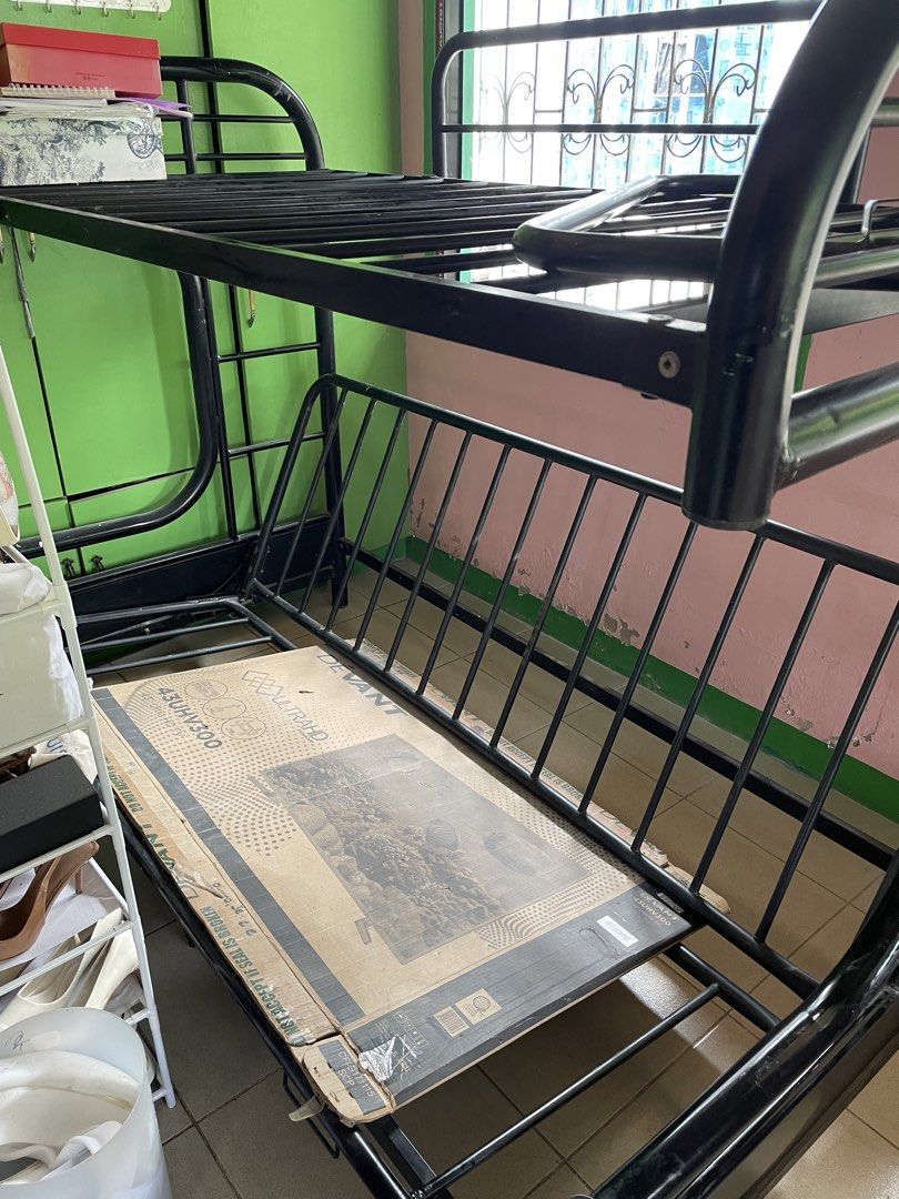 Double Deck (Category: Bed Frames & Mattresses) located in Manila. Submitted by jairahthel (Listing ID 1463290703, Image 2). Description: - Sturdy black metal double deck bed frame - Classic and space-saving design - Durable construction - Suitable for kids' rooms or guest rooms.