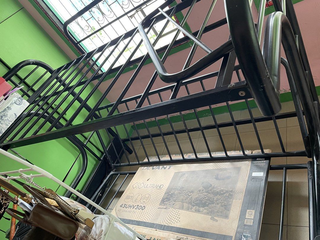 Double Deck (Category: Bed Frames & Mattresses) located in Manila. Submitted by jairahthel (Listing ID 1463290703, Image 1). Description: - Sturdy black metal double deck bed frame - Classic and space-saving design - Durable construction - Suitable for kids' rooms or guest rooms.
