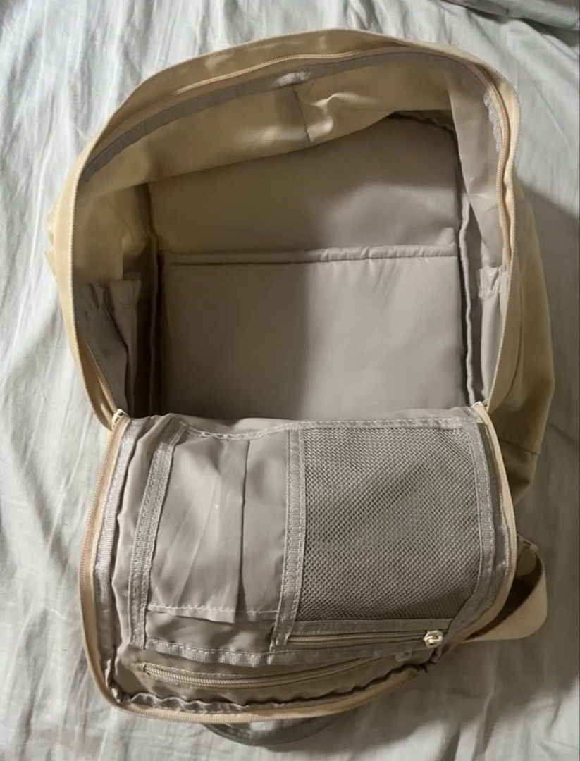 Doughnut Macaroon Backpack Beige (Category: Backpacks) located in Makati City. Submitted by diannecheryl (Listing ID 1463179813, Image 3). Description: - Beige Doughnut Macaroon backpack - Multiple interior compartments for organization - Water-repellent material - Adjustable straps - Ideal for school or everyday use - Note: Minor marks present on the back straps.