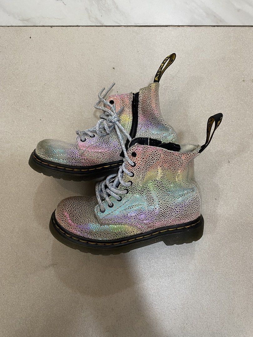 Dr. Martens 1460 Pascal Rainbow Glitter Boots (Category: Boots) located in Alburquerque. Submitted by zanegavynn43872 (Listing ID 1463129449, Image 2). Description: - Kids' Dr. Martens boots with a fun rainbow glitter effect. Size 6 months to 1 yr - Features both side zip and laces for easy wear. - Iconic yellow stitching and comfortable air-cushioned sole. - Perfect for everyday adventures..