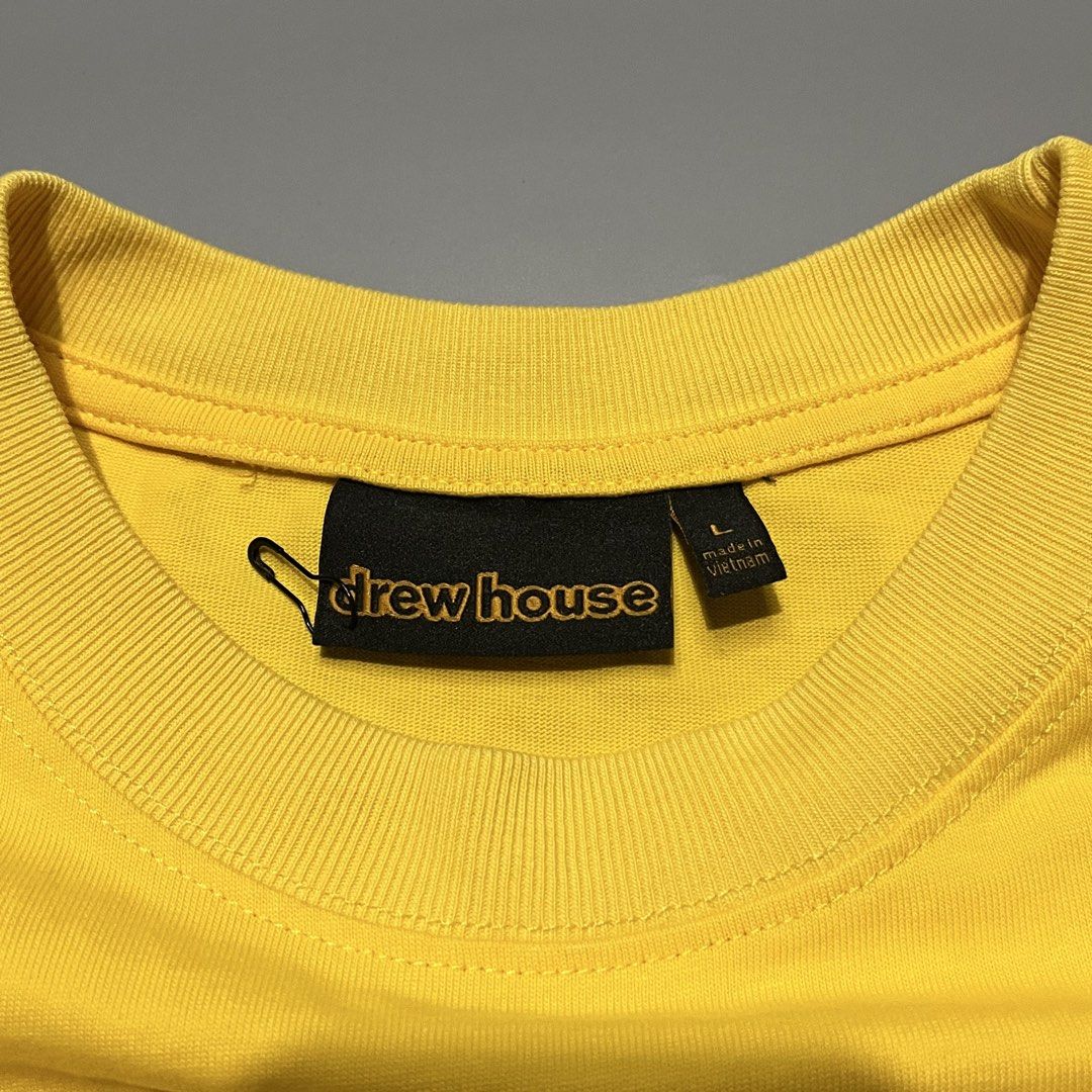Drew House Mascot SS Tee Yellow (Category: Tshirts & Polo Shirts ) located in Las Pinas. Submitted by r4nd0m.thr1ft (Listing ID 1463283169, Image 3). Description: Drew House Mascot T-shirt — Large on tag 22.5 width x 29.5 length Very good condition, minimal scratch on print Price: 550+sf No reservations. First to pay ✌🏻 All items are thrifted/pre-loved, so please manage your expectations 🙇🏻 Color may vary due to lighting 📸.