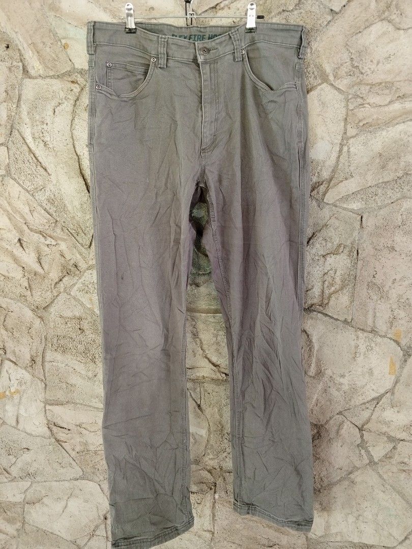 Duluth Trading Co. Grey Work Pants (Category: Jeans) located in Orani. Submitted by thriftniea (Listing ID 1463203771, Image 1). Description: W36-38 L45 H8 - Duluth Trading Co. grey work pants - Classic five-pocket styling - Durable material, suitable for work or casual wear - Features minor wear and a small tear on the right pocket seam (as pictured) - Offers a comfortable fit.