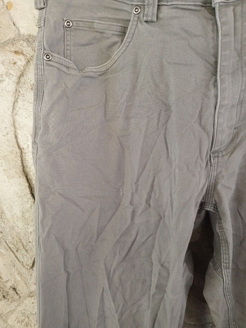 Duluth Trading Co. Grey Work Pants (Category: Jeans) located in Orani. Submitted by thriftniea (Listing ID 1463203771, Image 3). Description: W36-38 L45 H8 - Duluth Trading Co. grey work pants - Classic five-pocket styling - Durable material, suitable for work or casual wear - Features minor wear and a small tear on the right pocket seam (as pictured) - Offers a comfortable fit.