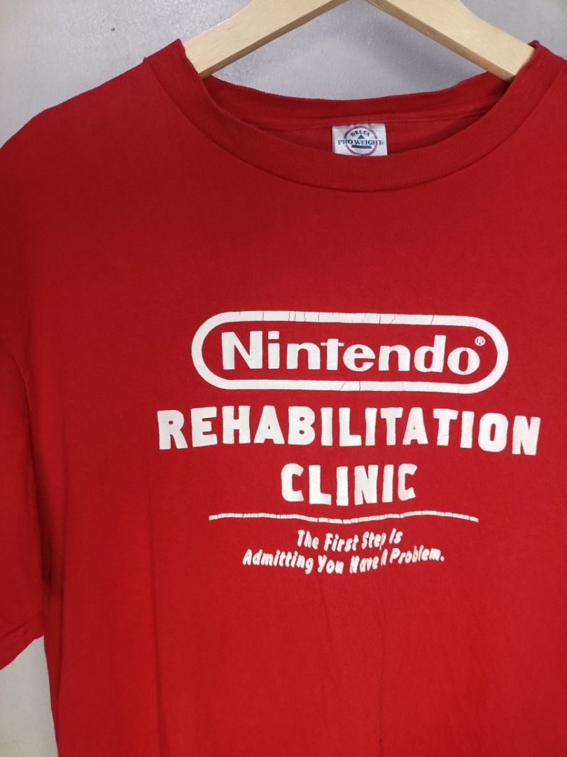 Early 2000s Nintendo Humor Tee (Category: Tshirts & Polo Shirts ) located in Cabuyao City. Submitted by junkthreads.finds (Listing ID 1463252310, Image 2). Description: Early 00s Nintendo Humor Tee Tag: Delta pro weight Dimes: 20x25.5 Issue(s): Hairlines Color may vary due to lightning..