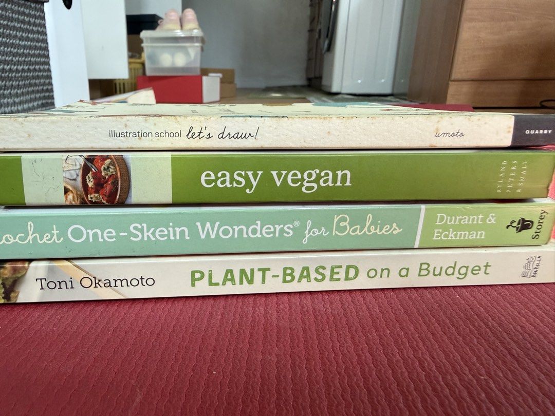 Plant-Based Cookbooks + Crochet Book (Category: Storybooks) located in Taguig. Submitted by secondlifeph (Listing ID 1463185706, Image 1). Description: - Selling two cookbooks: 'Easy Vegan' and 'Plant-Based on a Budget'. - 'Easy Vegan': Features simple recipes for healthy eating. - 'Plant-Based on a Budget': Offers delicious vegan meals for under $30 a week. - Recipes in 'Plant-Based on a Budget' take less than 30 minutes to prepare. - Ideal for 