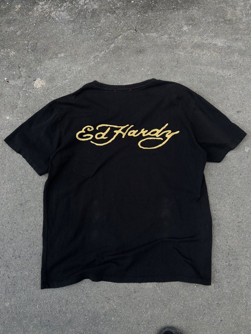 Ed Hardy Black T-Shirt with Tiger Patch (Category: Tshirts & Polo Shirts ) located in Angeles City. Submitted by luxy.thrifts (Listing ID 1463243197, Image 1). Description: - Black Ed Hardy T-shirt - Size L (based on tag) - Classic Ed Hardy script logo on the back - Cool tiger patch on the front left chest - Ed Hardy branding tape on the collar -Angeles City, Pampanga 📍 .